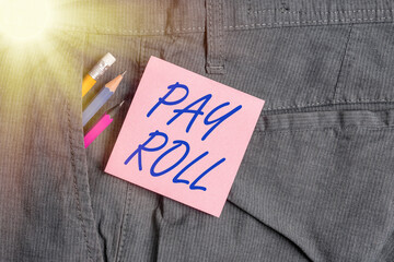 Conceptual hand writing showing Pay Roll. Concept meaning processing taxation and accounting to calculate salary payment Writing equipment and pink note paper inside pocket of trousers