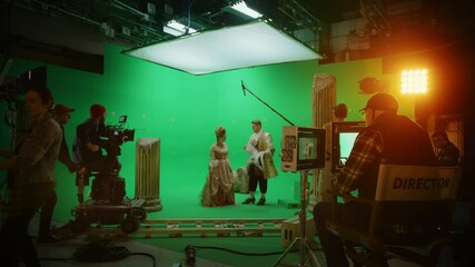 Wall Mural - On Big Film Studio Professional Crew Shooting History Costume Drama Movie. On Set: Director Controls Cameraman Shooting Green Screen Scene with Two Actors Talented Wearing Renaissance Clothes Talking