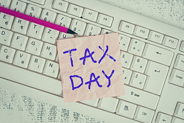 Wall Mural - Handwriting text writing Tax Day. Conceptual photo due for individual income tax that should be submitted to the government White keyboard office supplies empty rectangle shaped paper reminder wood