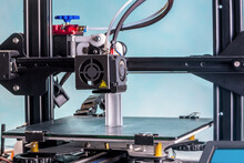 The 3D Printer Prints White Plastic Model