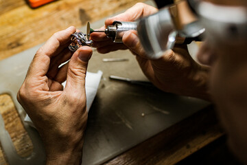 close-up. The jeweler makes a silver ring. On the island of Bali. Indonesia