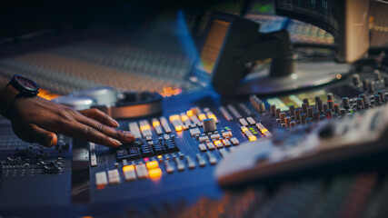 Poster - Close-up Shot of a Surface Control Desk Equalizer Mixer. Buttons, Faders, Sliders to Broadcast, Record, Play Hit Song. Artist Works in the Music Record Studio.