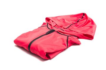 Folded red zipper windbreaker jacket, UV sun proof outdoor jacket hoodie. Track jacket sport hoodie full zip isolated on white background. Folded clothes.