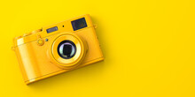 Yellow Vintage Photo Camera On Yellow Background.