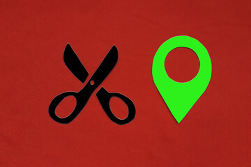 Fototapete - Scissors, a green geolocation sign on a red background. Location of the hair salon.