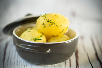 early boiled potato with butter and fresh dill