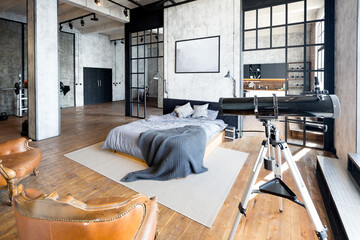 luxury studio apartment with a free layout in a loft style in dark colors. stylish modern kitchen ar