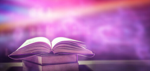 Poster - the concept of education by planting a tree of knowledge in the opening of an old book in the librar
