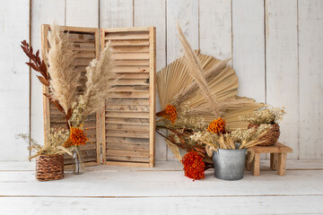 Old wooden background with red flowers.