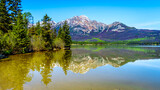 Fototapeta  - Reflection of Pyramid Mountain in Pyramid Lake in Jasper National Park in Alberta, Canada. The mountains is part of the Victoria Cross Range in the Rocky Mountains