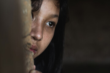 Wall Mural - Young girl with eye sad and hopeless. Human trafficking concept.