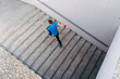 © arthurhidden - Young man running upstairs on city stairs. Fitness, sport, people, exercising and lifestyle concept