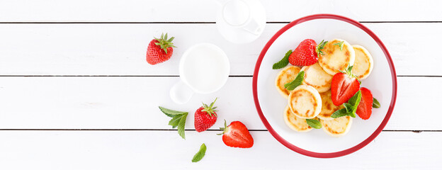 Sticker - Cheese pancakes, fritters or syrniki with fresh strawberry and yogurt. Healthy and tasty breakfast. Banner