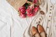 © Floral Deco - Beauty fashion collage with women's clothes and accessory on white linen. Sun dress sarafan, leather shoes, pink peony flowers in straw bag. Flat lay, top view fashion blog lifestyle concept