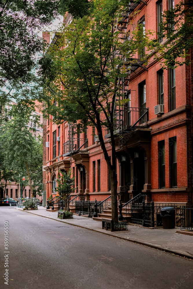 Street in Greenwich Village, Soho district. Beautiful houses and ...
