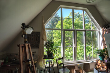 Wall Mural - Sunlight peeking through the large window in the vintage interior