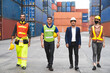 © tool51 - Business men, Engineer and Foreman teamwork and determination to succeed import and export support logistics Container , transportation concept.