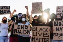 People From Different Culture And Races Protest On The Street For Equal Rights - Demonstrators Wearing Face Masks During Black Lives Matter Fight Campaign - Focus On Black Woman Face