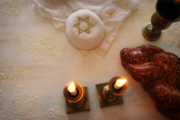 Wall Mural - shabbat image. challah bread, shabbat wine and candles. Top view. Low key