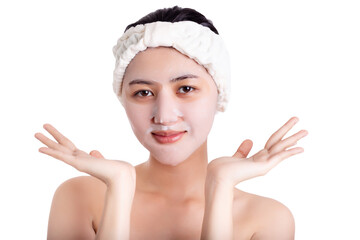 Asian young woman applying facial mask on beauty face Attractive beautiful girl use moisturizer facial mask every week for anti aging on beautiful face cosmetology, beauty care concept. isolated white