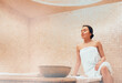 Attractive woman relaxing at hammam. Body recovery at hamam, traditional turkish bath