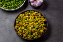 Chopped Raw Okra Mixed With Turmeric Powder In A Bowl, Preparation For Indian Vegetable Bhindi Fry