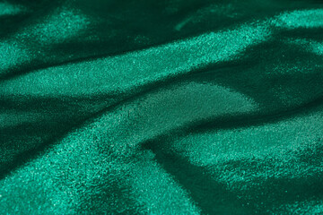 Wall Mural - Wavy texture of green silk fabric. Colorful background with expensive holiday canvas.
