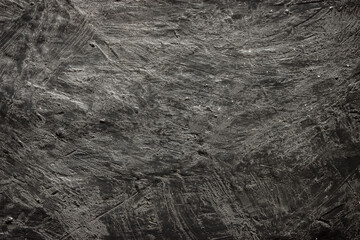 Dark grunge gray background with space for design. Grey dirty plaster texture .