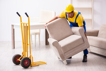 Young Male Contractor In Relocation Concept