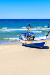 Wall Mural - Fishing boats on sandy beach in Chlopy village port, Baltic Sea coast, Poland