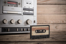 Old Tape Recorder And Cassette On  Wooden Background