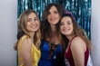 © Mat Hayward - Mother and two teenage daughters having fun together at a family party
