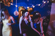 © Mat Hayward - Group of three girls dancing and having fun at a birthday party with a disco ball