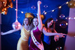 © Mat Hayward - Group of three girls dancing and having fun at a birthday party with a disco ball