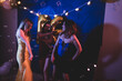 © Mat Hayward - Group of three women dancing and singing at a party