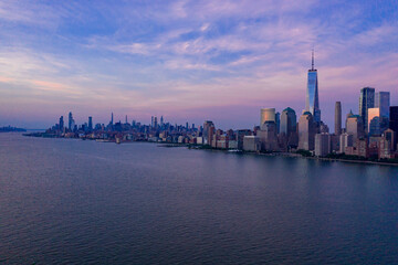 Wall Mural - Aerial view of low Manhattan, new york at beautiful cloudy dusk from Hudson river