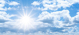 Fototapeta Na sufit - Hot cloudy summer background banner panorama - Blue sky with clouds and glowing sun