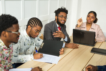 Wall Mural - team of young african people in the office at the table