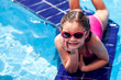 © Aleksej - Kid girl playing in the swimming pool. Childhood, summer and vacation concept