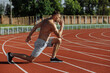 © Maksym - Shirtless athlete man making lunges at the stadium. Sportsman. Strong man