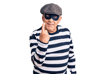 Sticker - Senior handsome man wearing burglar mask and t-shirt beckoning come here gesture with hand inviting welcoming happy and smiling