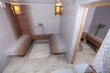Hamam, traditional turkish sauna. Classic hammam interior design. Mosaic walls and benches.
