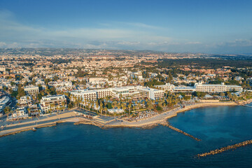 Wall Mural - Aerial view of Paphos embankment in Cyprus. Coastline with hotels, cafes, restaurants and walking area, view from above.