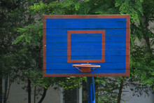 Basketball Wooden Backboard With A Ring On An Indoor Yard