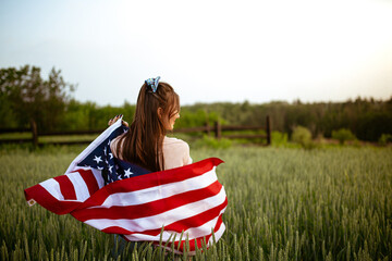 Independence day concept with woman holding american flag