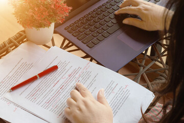 Wall Mural - working hands on blurred paperwork and laptop