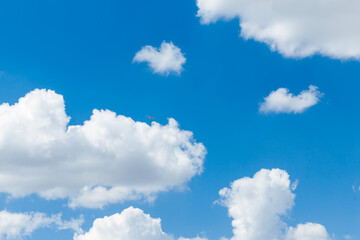 Wall Mural - blue clear sky with white fluffy clouds. natural background