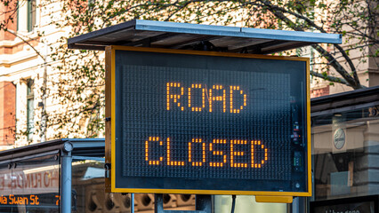 Road Closed electronic sign in a city road.