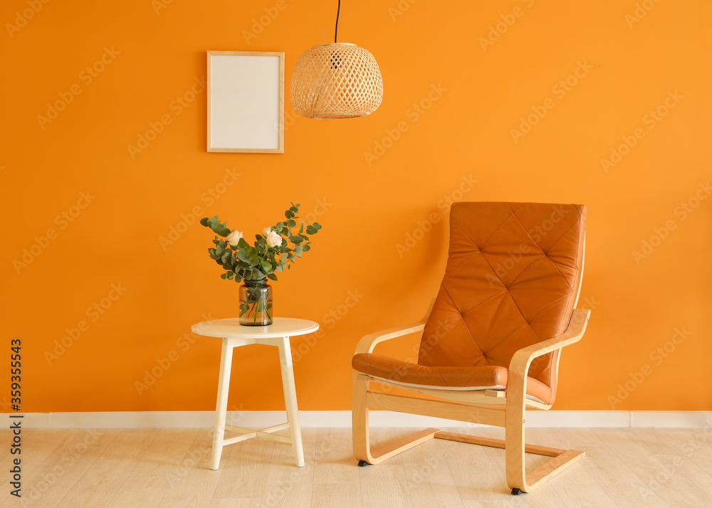 Interior of room with table and armchair