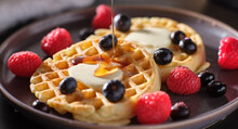 breakfast plate with waffles and berries